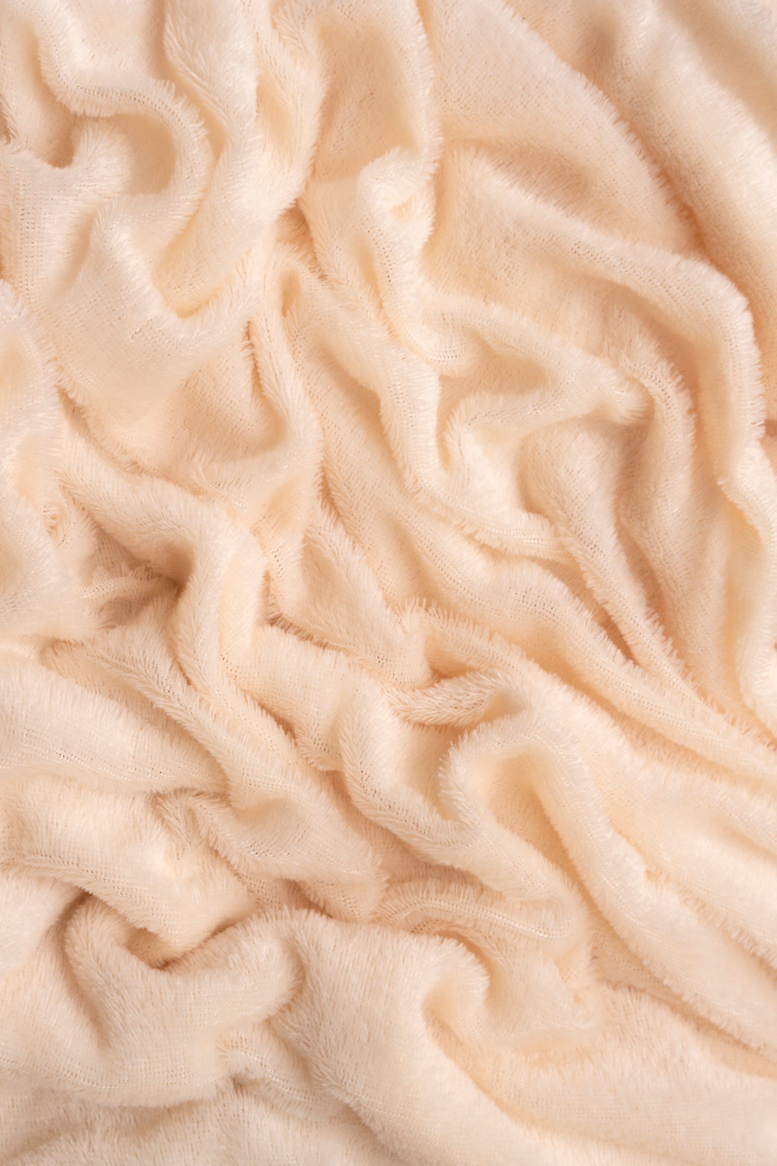 Close-up of beige textured fabric
